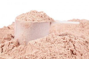 A scoop of chocolate whey isolate protein